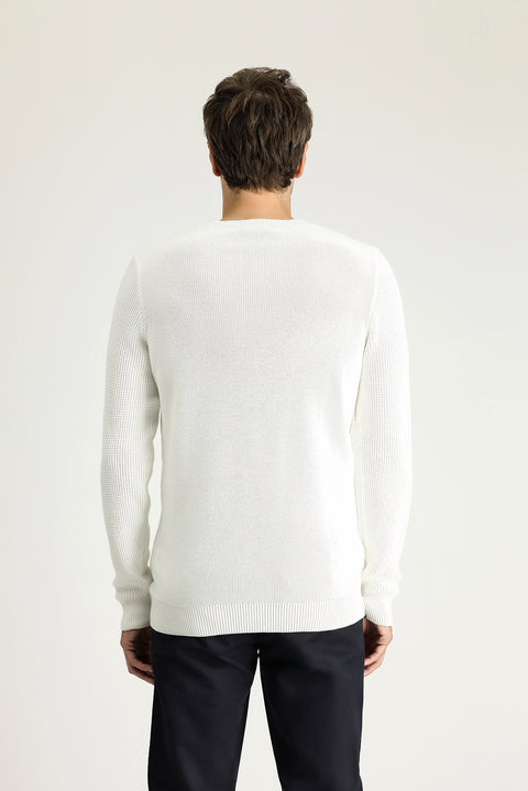 Off-white crew neck slim fit patterned cotton knit sweater.