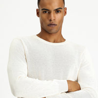 Off-white crew neck regular fit patterned cotton knit sweater.